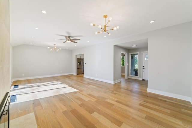 empty room featuring light wood-type flooring, visible vents, baseboards, and a notable chandelier