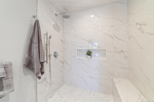 full bathroom with a marble finish shower