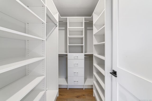 spacious closet with wood finished floors