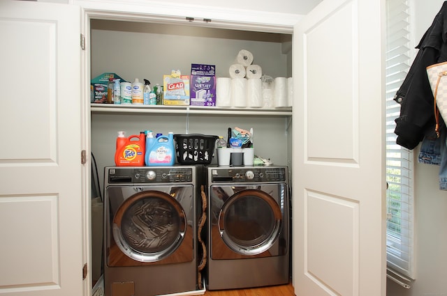 laundry area with laundry area and independent washer and dryer
