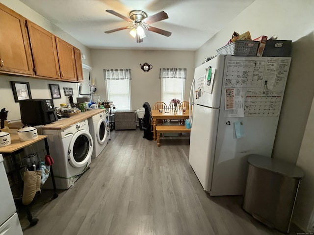 25-27 Farrows St, Putnam, CT 06260 - washroom featuring washer and dryer, ceiling fan, and light wood-style floors