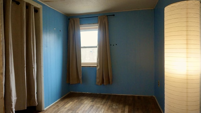 spare room with hardwood / wood-style floors