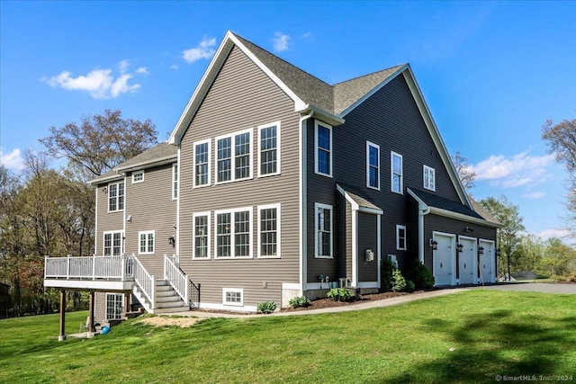 view of front of property with driveway, a deck, and a front yard
