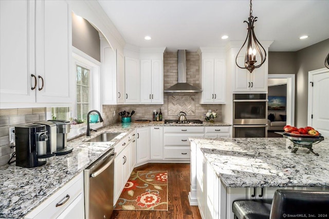 kitchen featuring wall chimney exhaust hood, white cabinetry, stainless steel appliances, and dark wood-style floors