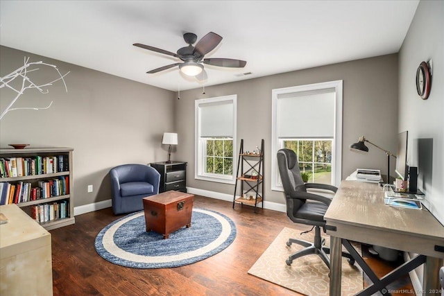 home office featuring baseboards, a ceiling fan, wood finished floors, and visible vents