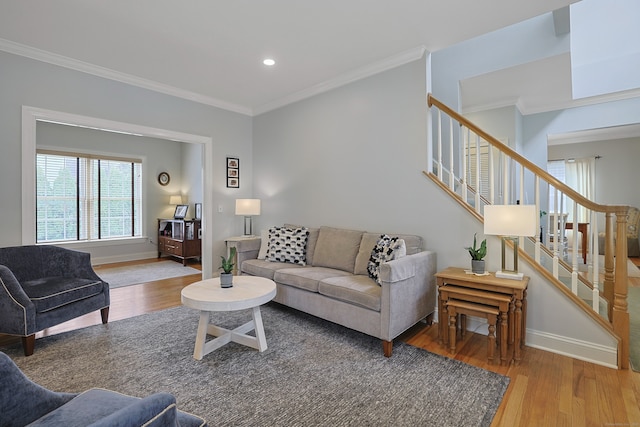 living room with stairs, wood finished floors, recessed lighting, crown molding, and baseboards