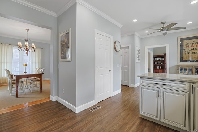 interior space featuring a chandelier, baseboards, visible vents, and dark wood-style floors