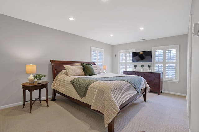 bedroom featuring light carpet, baseboards, visible vents, and recessed lighting