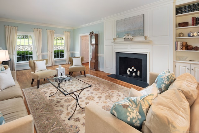6 Wahackme Ln, New Canaan, CT 06840 - living room with crown molding, a fireplace with flush hearth, and wood finished floors