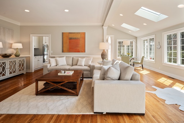 6 Wahackme Ln, New Canaan, CT 06840 - living room featuring crown molding, recessed lighting, baseboards, wood finished floors, and lofted ceiling with skylight