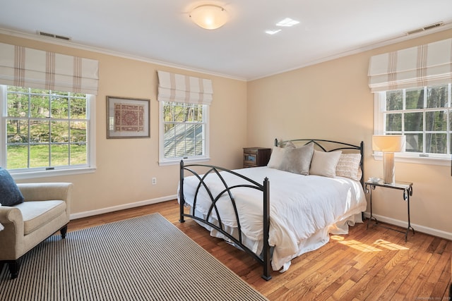 6 Wahackme Ln, New Canaan, CT 06840 - bedroom featuring visible vents, ornamental molding, baseboards, and wood finished floors