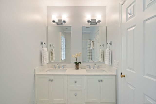 6 Wahackme Ln, New Canaan, CT 06840 - bathroom featuring a sink, double vanity, and a shower with shower curtain