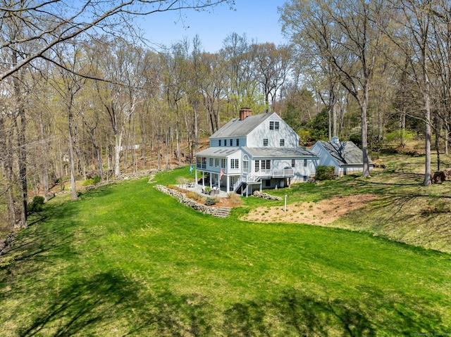 6 Wahackme Ln, New Canaan, CT 06840 - back of property featuring a lawn, stairway, a chimney, and a wooden deck