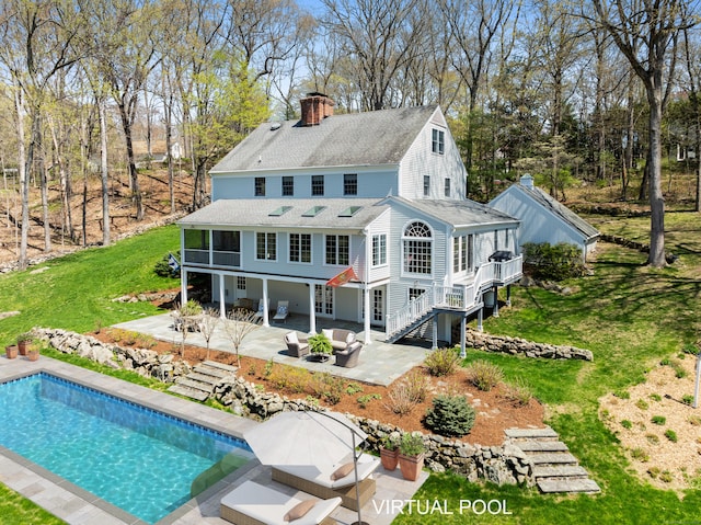 6 Wahackme Ln, New Canaan, CT 06840 - back of house featuring stairs, a shingled roof, a chimney, a lawn, and a patio