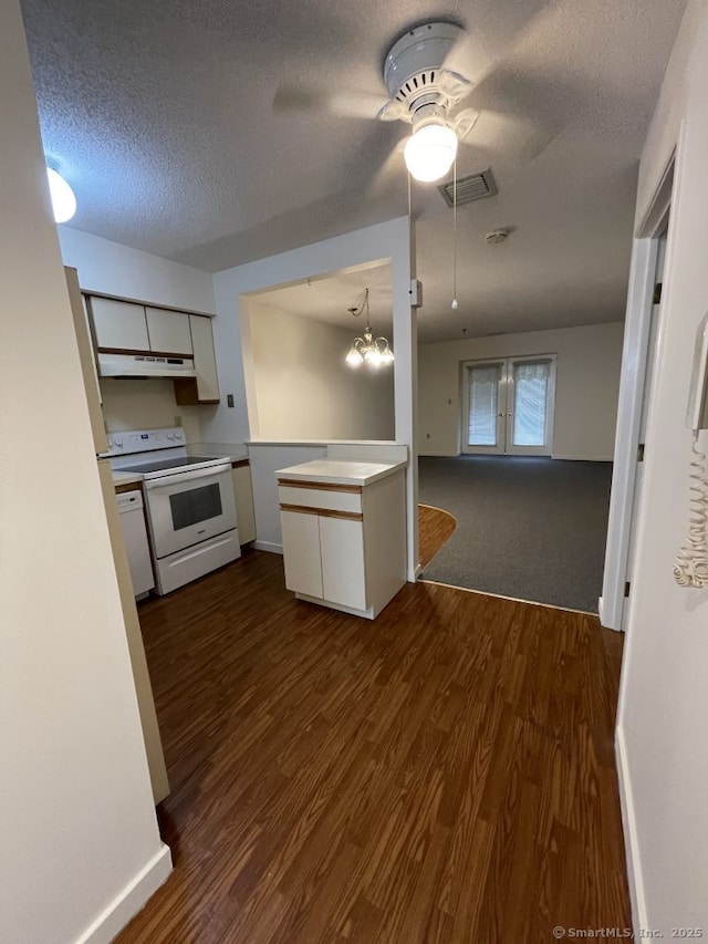 75 Washington Ave Unit 4207, Hamden, CT 06518 - kitchen with white appliances, ceiling fan, white cabinets, dark wood-style floors, and under cabinet range hood