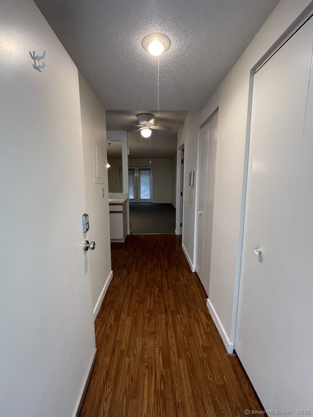 75 Washington Ave Unit 4207, Hamden, CT 06518 - corridor with a textured ceiling, wood finished floors, and baseboards