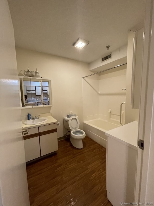 75 Washington Ave Unit 4207, Hamden, CT 06518 - full bath featuring vanity, toilet, wood finished floors, and bathing tub / shower combination
