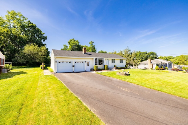 31 Mountain View Dr, Rocky Hill, CT 06067 - view of front of home with a chimney, a front yard, driveway, and a garage