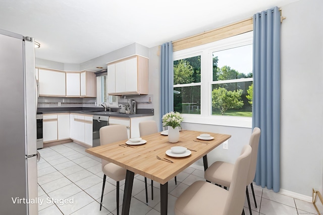 31 Mountain View Dr, Rocky Hill, CT 06067 - kitchen featuring stainless steel appliances, dark countertops, light tile patterned floors, backsplash, and white cabinetry