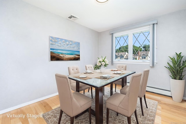 31 Mountain View Dr, Rocky Hill, CT 06067 - dining area featuring light wood-style floors and a baseboard heating unit