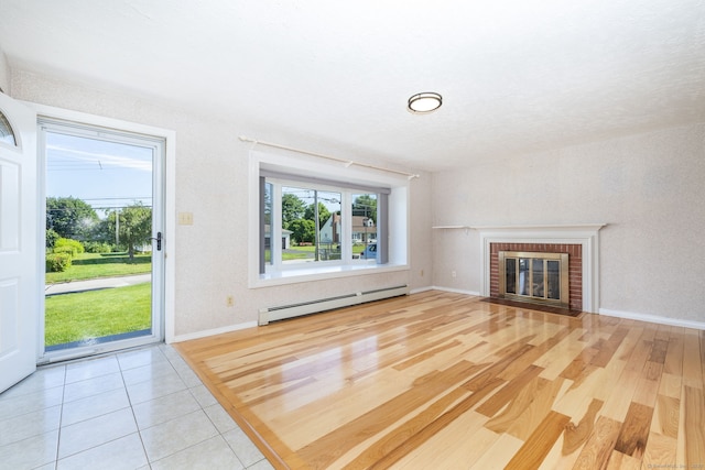 31 Mountain View Dr, Rocky Hill, CT 06067 - unfurnished living room featuring a baseboard heating unit, a fireplace, and wood finished floors