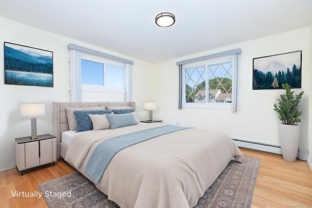 31 Mountain View Dr, Rocky Hill, CT 06067 - bedroom with baseboard heating and light wood finished floors