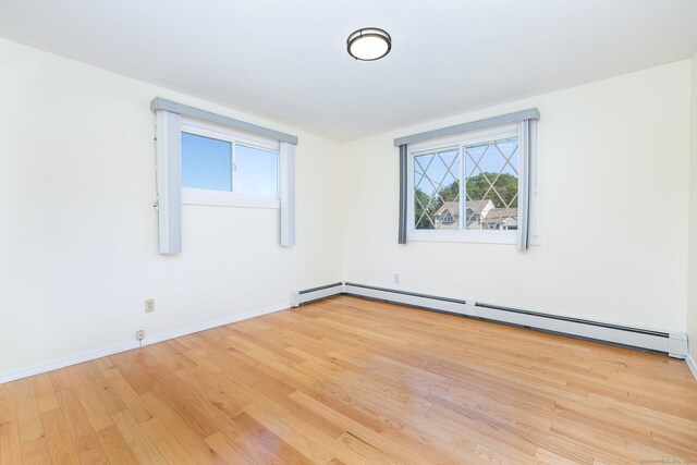 31 Mountain View Dr, Rocky Hill, CT 06067 - spare room featuring a baseboard heating unit and light wood-type flooring