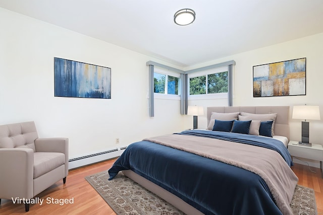 31 Mountain View Dr, Rocky Hill, CT 06067 - bedroom featuring a baseboard heating unit and light wood-style flooring