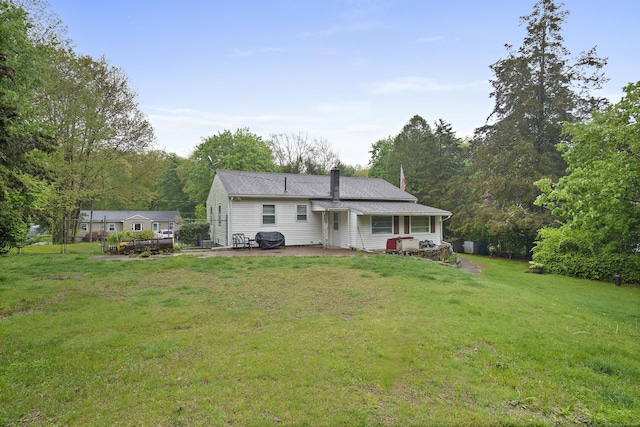 5 Stone Ct, Ledyard, CT 06335 - rear view of property with a chimney, a yard, and a patio