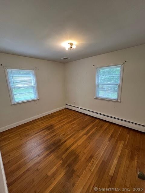 5 Stone Ct, Ledyard, CT 06335 - spare room featuring wood finished floors, a baseboard radiator, and baseboards