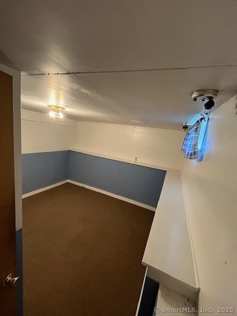 5 Stone Ct, Ledyard, CT 06335 - below grade area featuring dark colored carpet