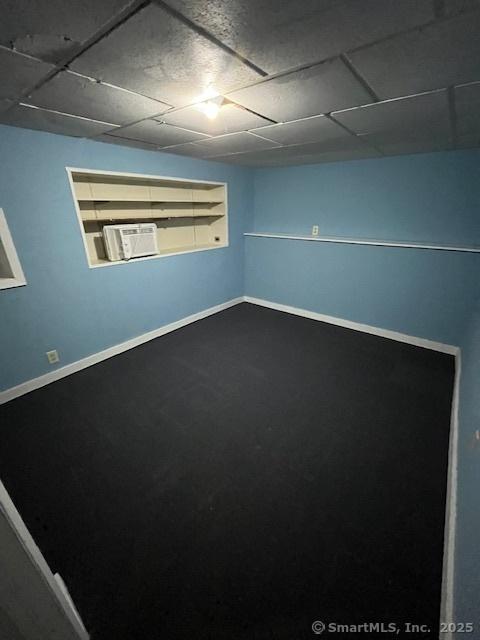 5 Stone Ct, Ledyard, CT 06335 - unfurnished room with a drop ceiling, carpet, baseboards, and a wall mounted AC