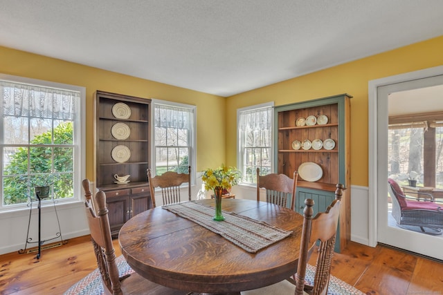 dining space with light wood-type flooring
