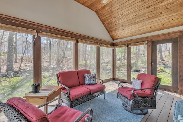 sunroom / solarium with plenty of natural light and an outdoor living space