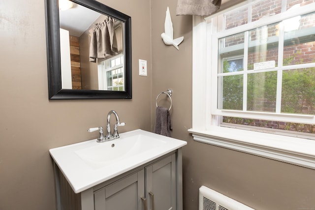 bathroom with a healthy amount of sunlight and vanity