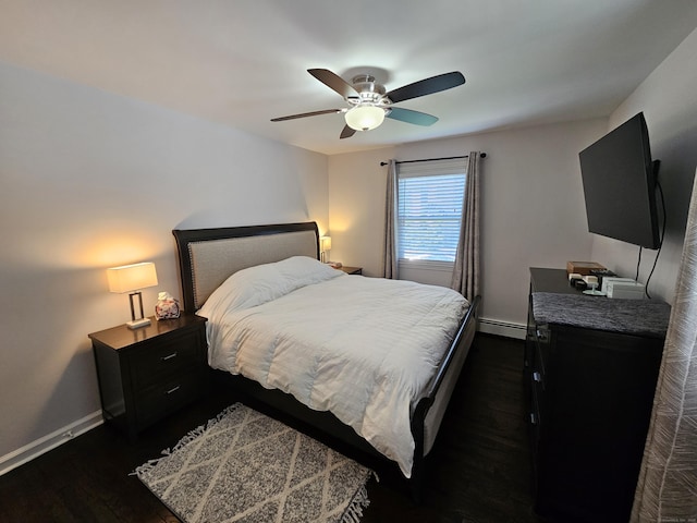 bedroom featuring a baseboard radiator, baseboards, dark wood-style flooring, and a ceiling fan