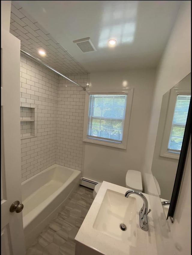 full bath with recessed lighting, bathing tub / shower combination, visible vents, vanity, and baseboard heating