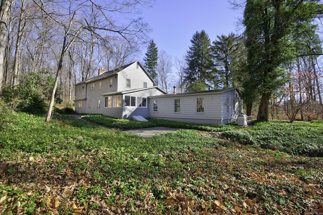 538 County Rd, Guilford, CT 06437 - rear view of house featuring a chimney