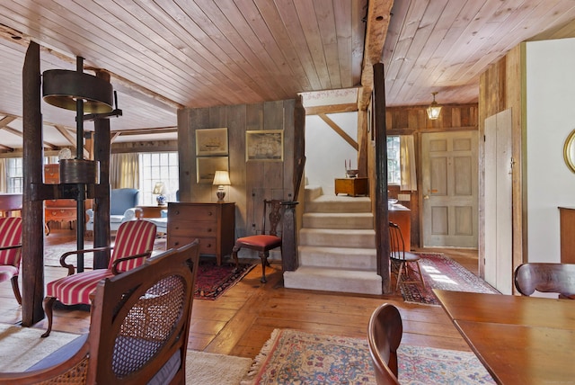 538 County Rd, Guilford, CT 06437 - living room with wooden walls, wooden ceiling, stairs, and wood-type flooring