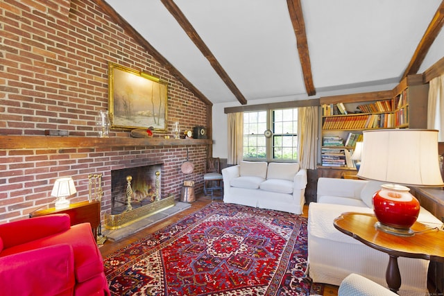 538 County Rd, Guilford, CT 06437 - living room featuring wood finished floors, brick wall, vaulted ceiling with beams, and a fireplace