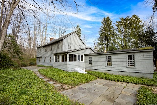 538 County Rd, Guilford, CT 06437 - rear view of property with a patio area and a chimney