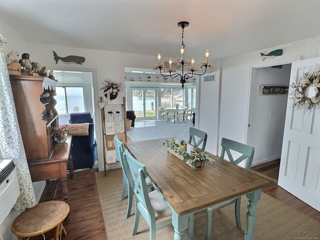 15 Beckett Ave, Branford, CT 06405 - dining area featuring a healthy amount of sunlight, visible vents, wood finished floors, and a chandelier