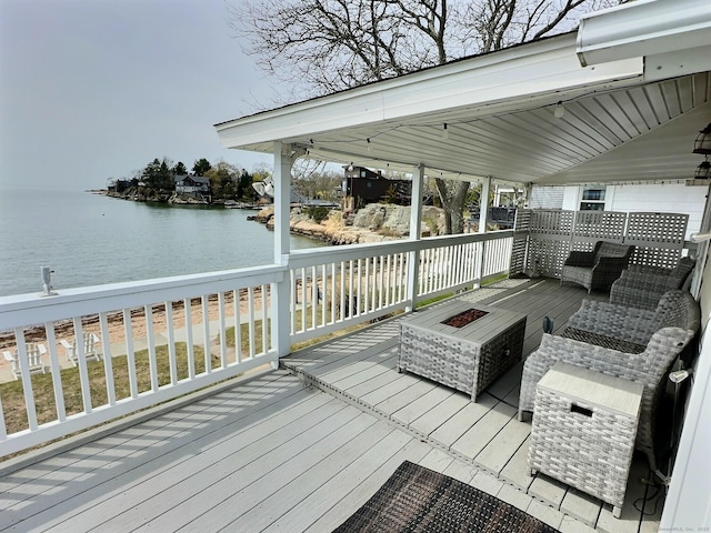 15 Beckett Ave, Branford, CT 06405 - wooden terrace with a water view and a fire pit