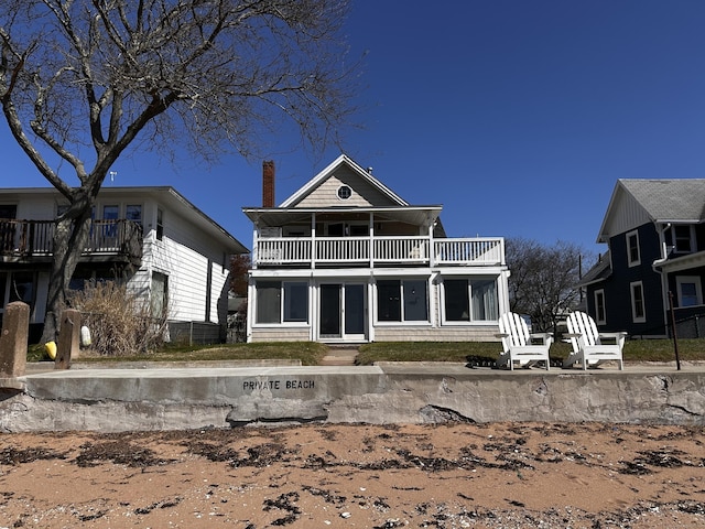 15 Beckett Ave, Branford, CT 06405 - rear view of property featuring a chimney and a balcony