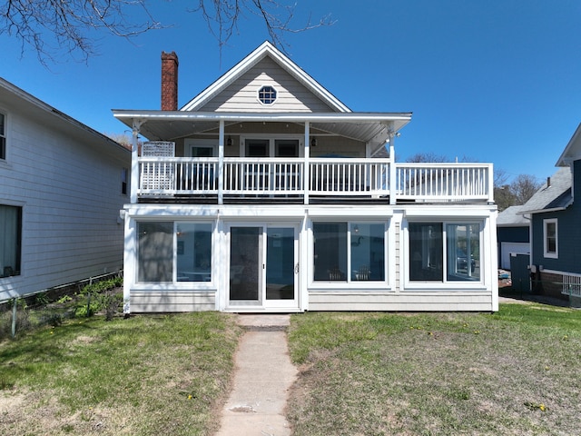 15 Beckett Ave, Branford, CT 06405 - rear view of house featuring a yard, a balcony, and a chimney