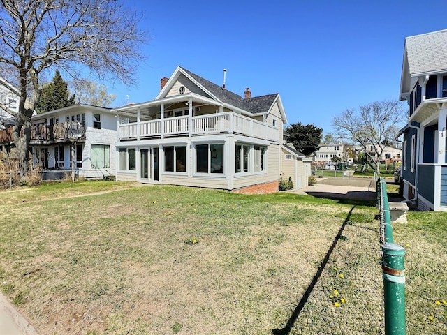 15 Beckett Ave, Branford, CT 06405 - back of property with a yard, a balcony, and a chimney