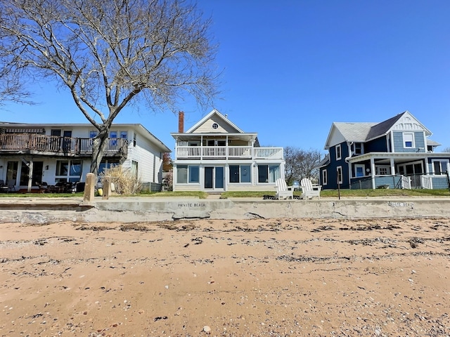 15 Beckett Ave, Branford, CT 06405 - rear view of property with a chimney and a balcony