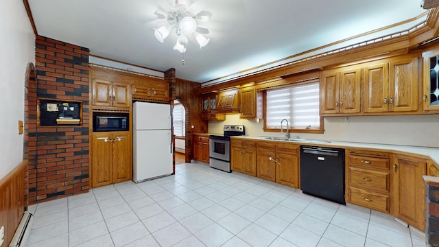 8 Kent St, Plainville, CT 06062 - kitchen with black appliances, a sink, ceiling fan, a baseboard radiator, and light countertops