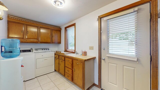 8 Kent St, Plainville, CT 06062 - washroom featuring independent washer and dryer, cabinet space, and light tile patterned floors