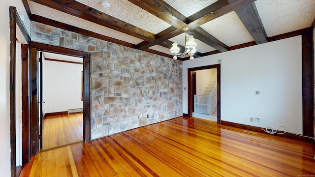 8 Kent St, Plainville, CT 06062 - spare room with hardwood / wood-style floors, a chandelier, beam ceiling, a baseboard heating unit, and a smoke detector